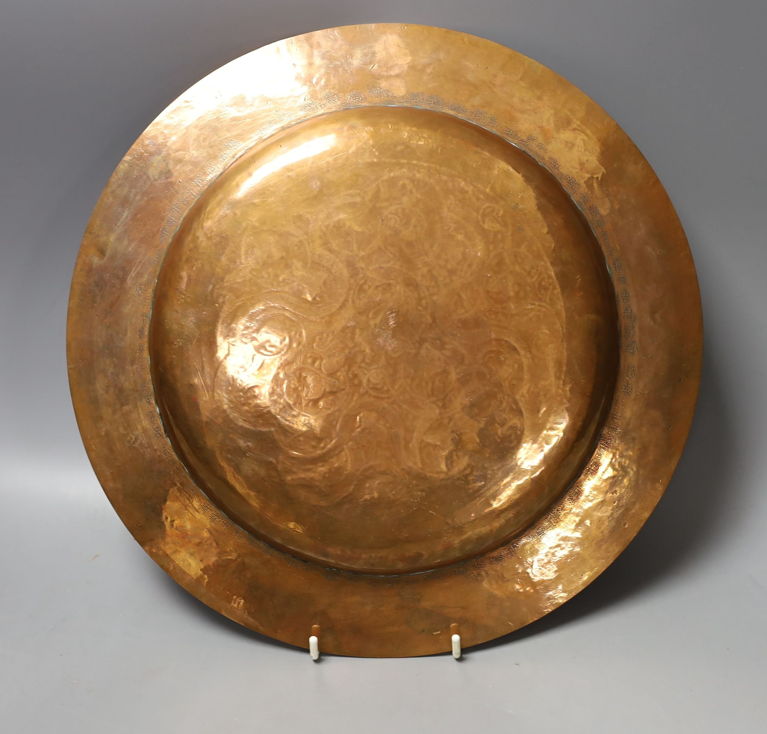 A copper and silver Islamic-style inlaid dish - 32cm diameter